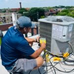 Technician performing AC servicing